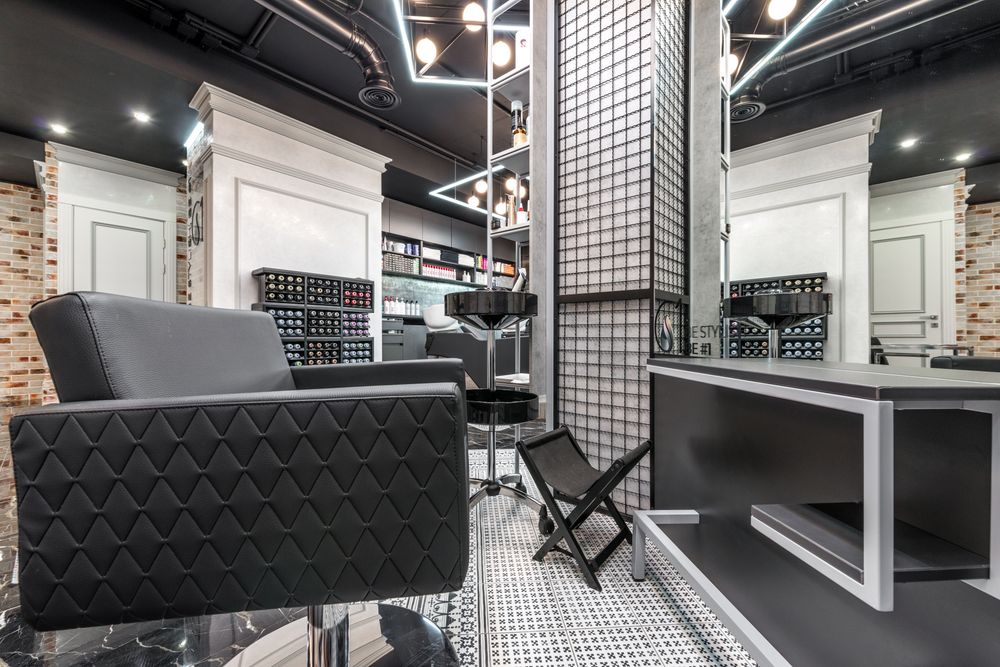 Illustrative minimalist salon styling chair, not the actual studio